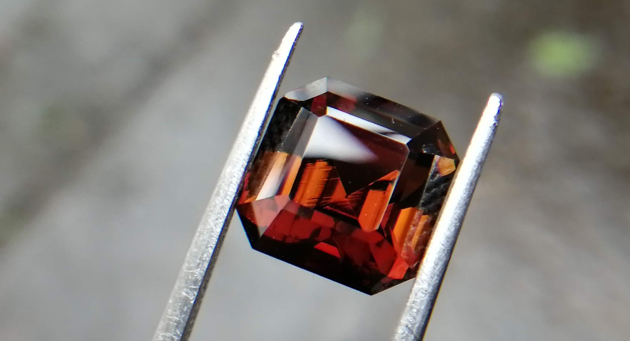 brown tourmaline oval cut on a dark background