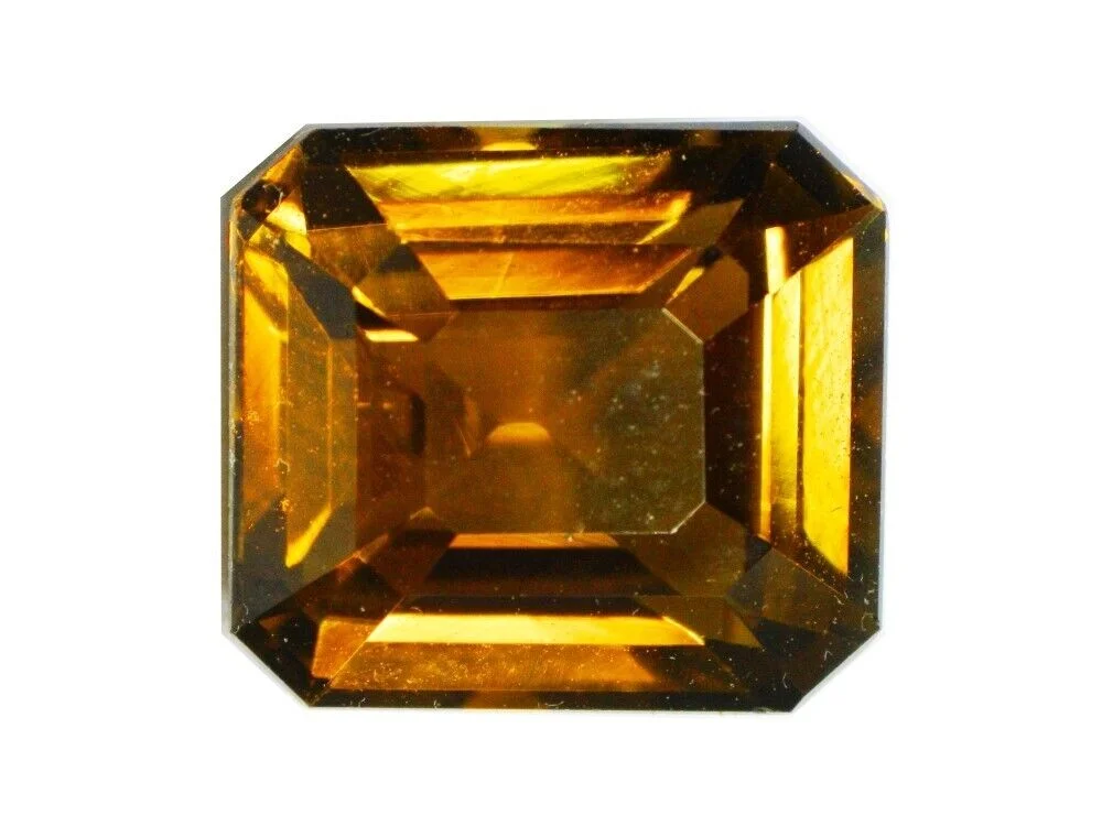 brown tourmaline oval cut on a dark background